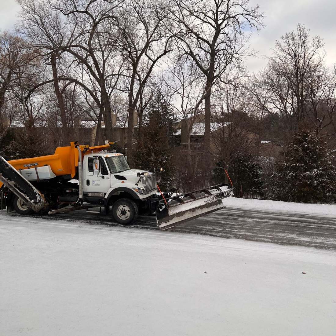 Illustrative snowplow clearing a winter road